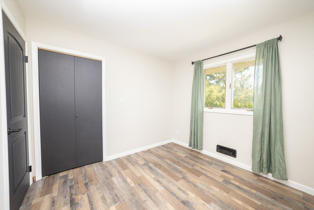 712 Homestead Place Joliet, IL 60435 - Photo 13 of 26 a bedroom with a bed and a window