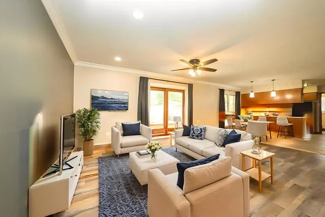 a living room with furniture and a flat screen tv