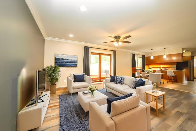 712 Homestead Place Joliet, IL 60435 - Photo 16 of 26 a living room with furniture and a flat screen tv