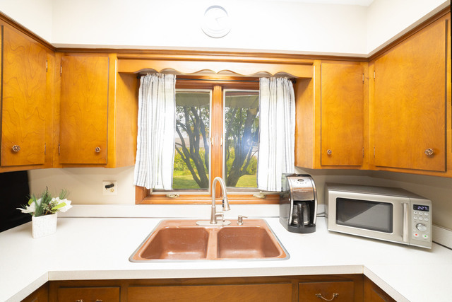 712 Homestead Place Joliet, IL 60435 - Photo 20 of 26 a kitchen with a sink and a window