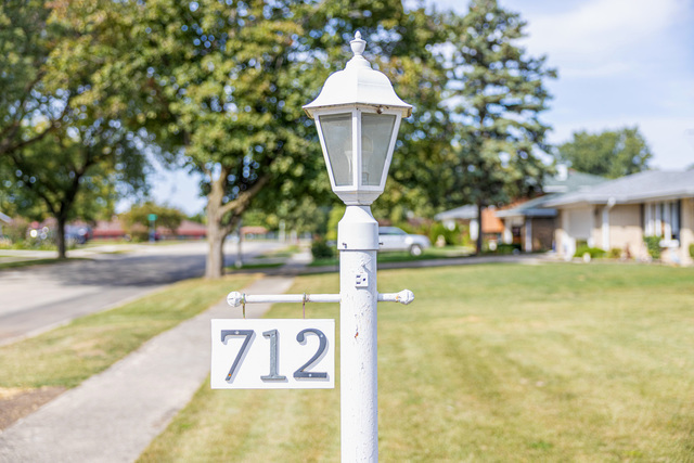 712 Homestead Place Joliet, IL 60435 - Photo 25 of 26 a front view of a building with trees