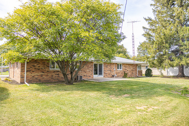 712 Homestead Place Joliet, IL 60435 - Photo 26 of 26 a view of a house with a yard and large tree