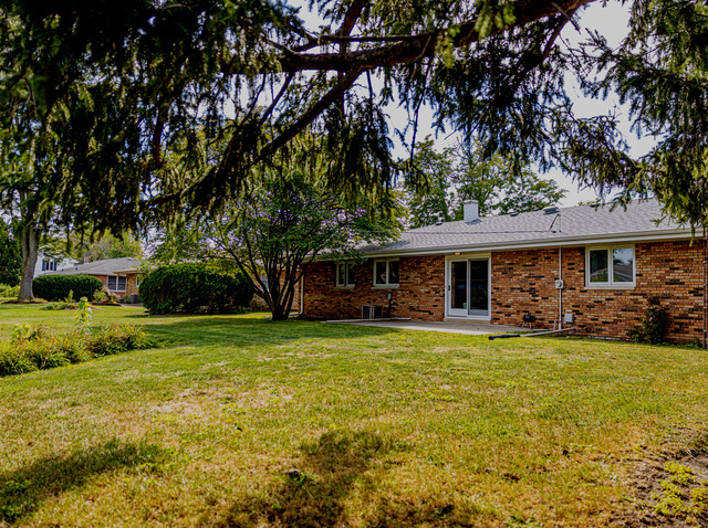 712 Homestead Place Joliet, IL 60435 - Photo 4 of 26 a view of a house with backyard and sitting area