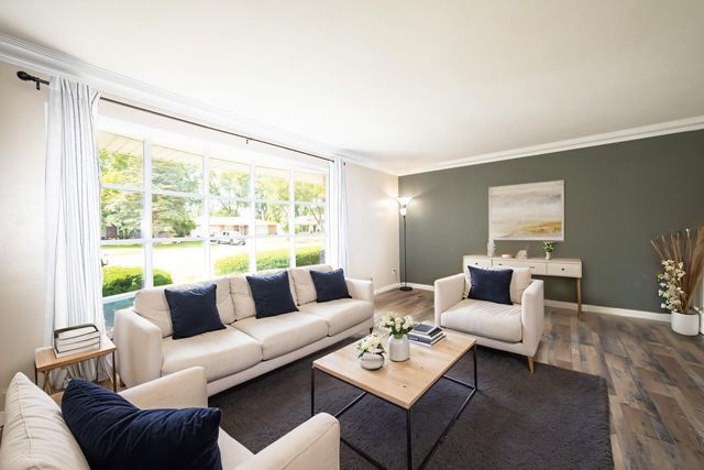 712 Homestead Place Joliet, IL 60435 - Photo 5 of 26 a living room with furniture and a large window
