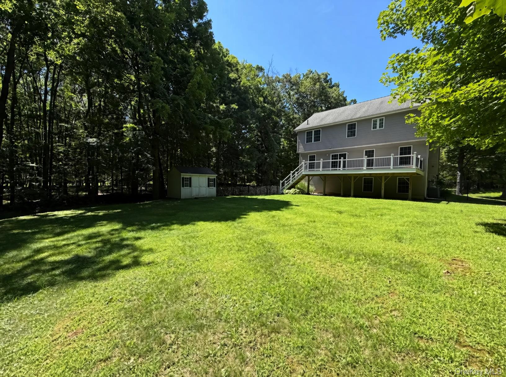 282 Derby Road Middletown, NY 10940 - Photo 15 of 15 Angle shot of house and shed with large level yard between.