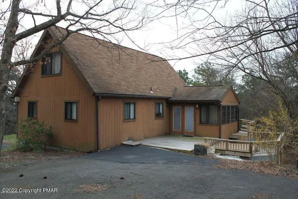 a house with a tree in the background