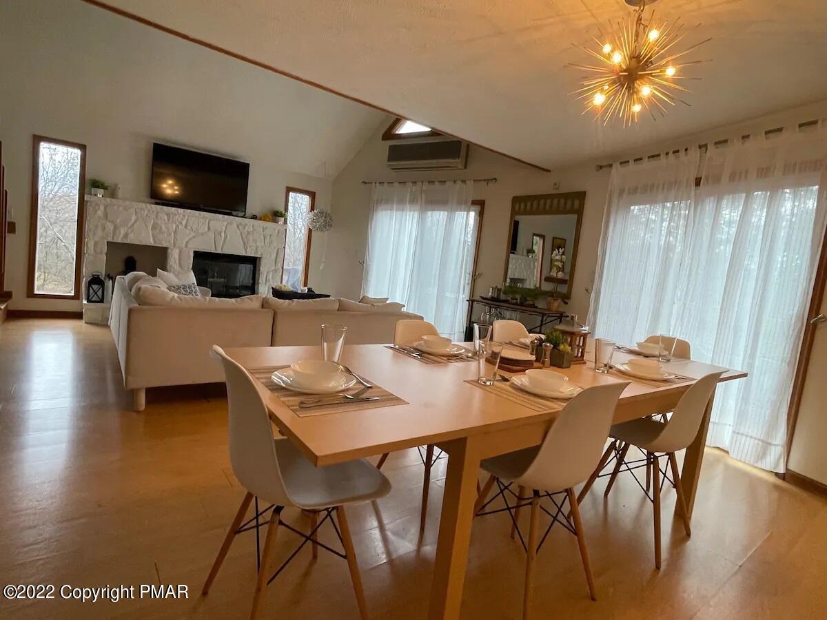 1421 Clover Road Long Pond, PA 18334 - Photo 12 of 31 a view of a dining room with furniture and a fireplace