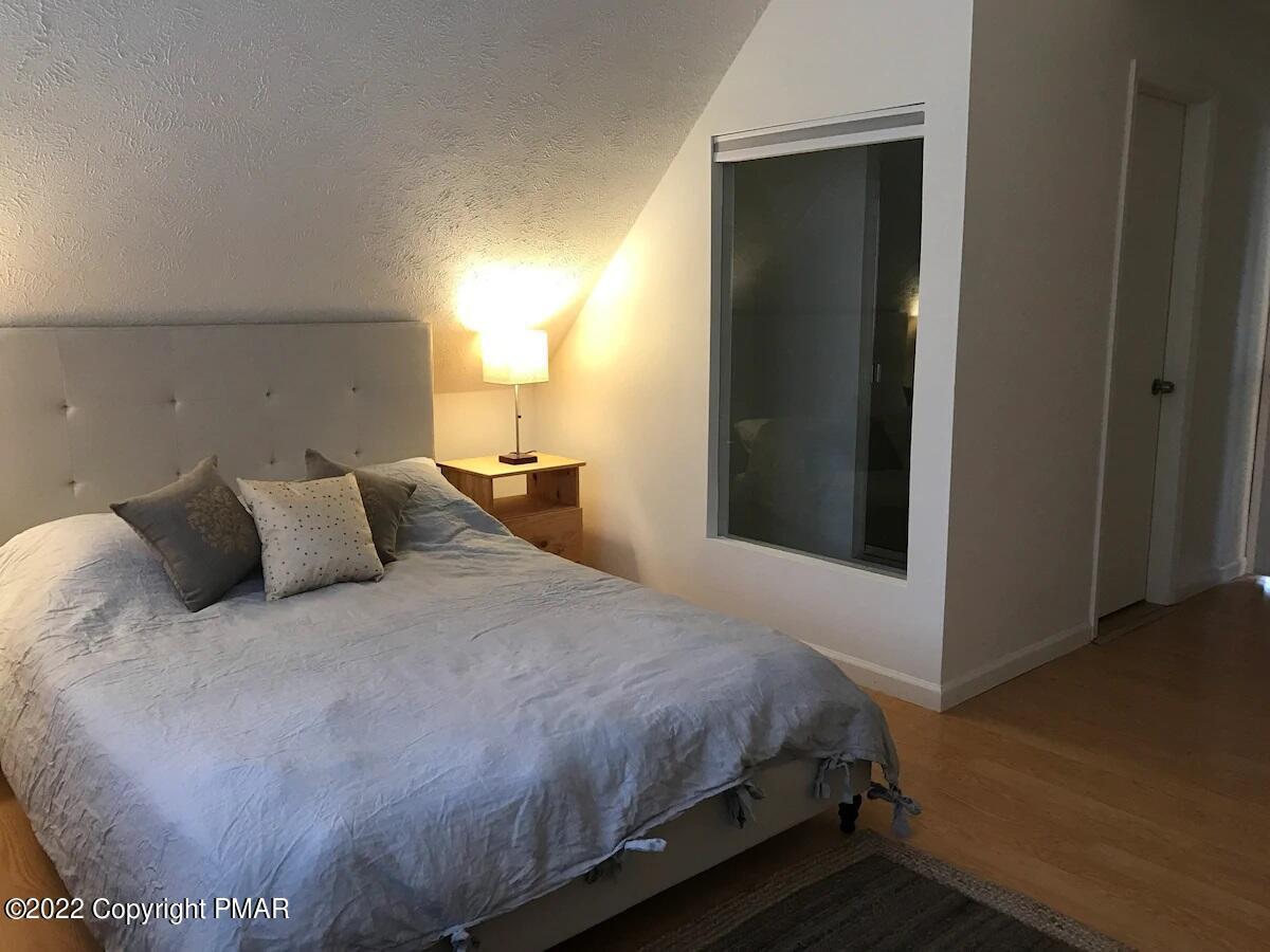 1421 Clover Road Long Pond, PA 18334 - Photo 15 of 31 a bedroom with a bed and a window