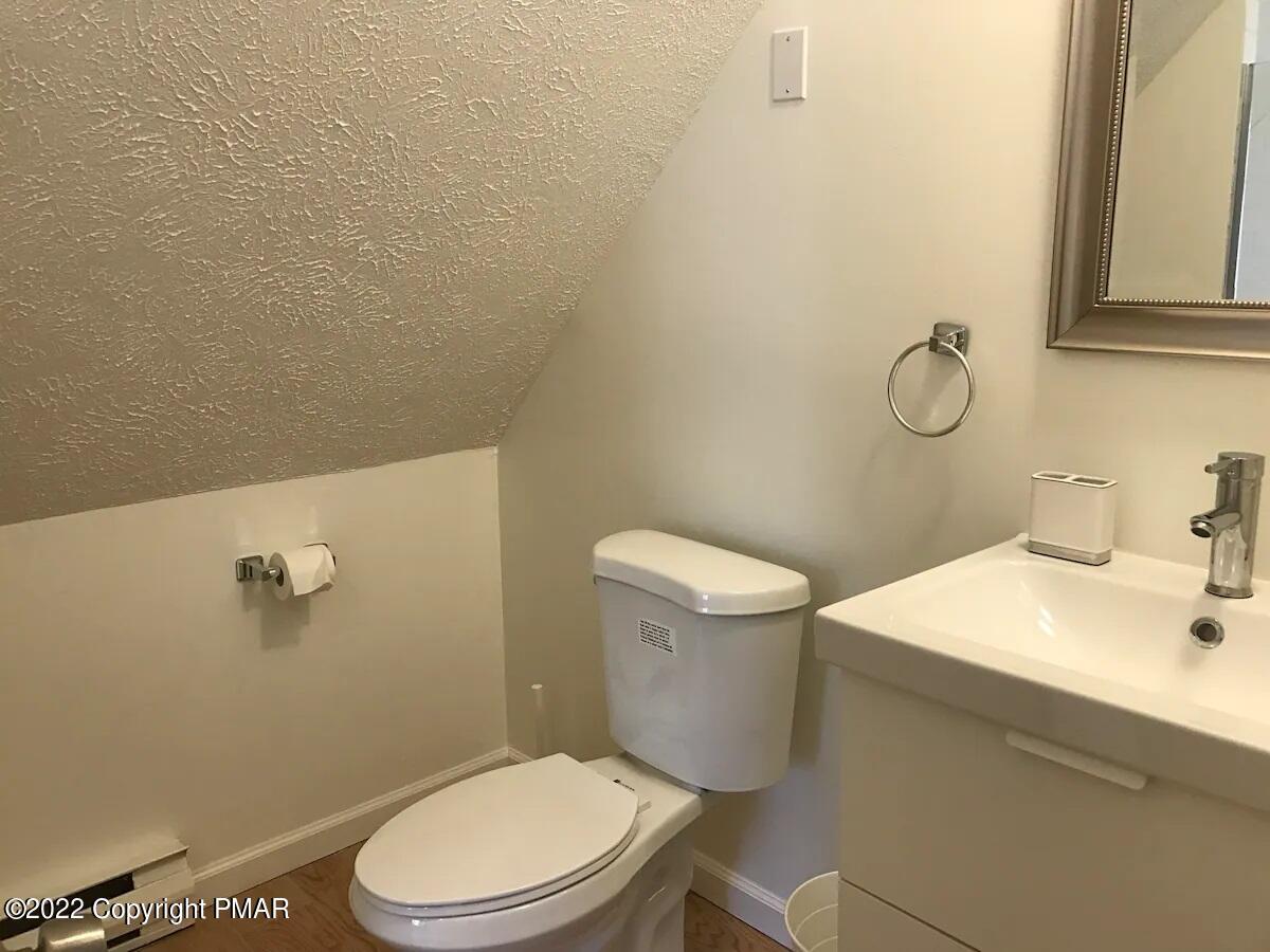 1421 Clover Road Long Pond, PA 18334 - Photo 18 of 31 a white toilet sitting next to a bathroom sink
