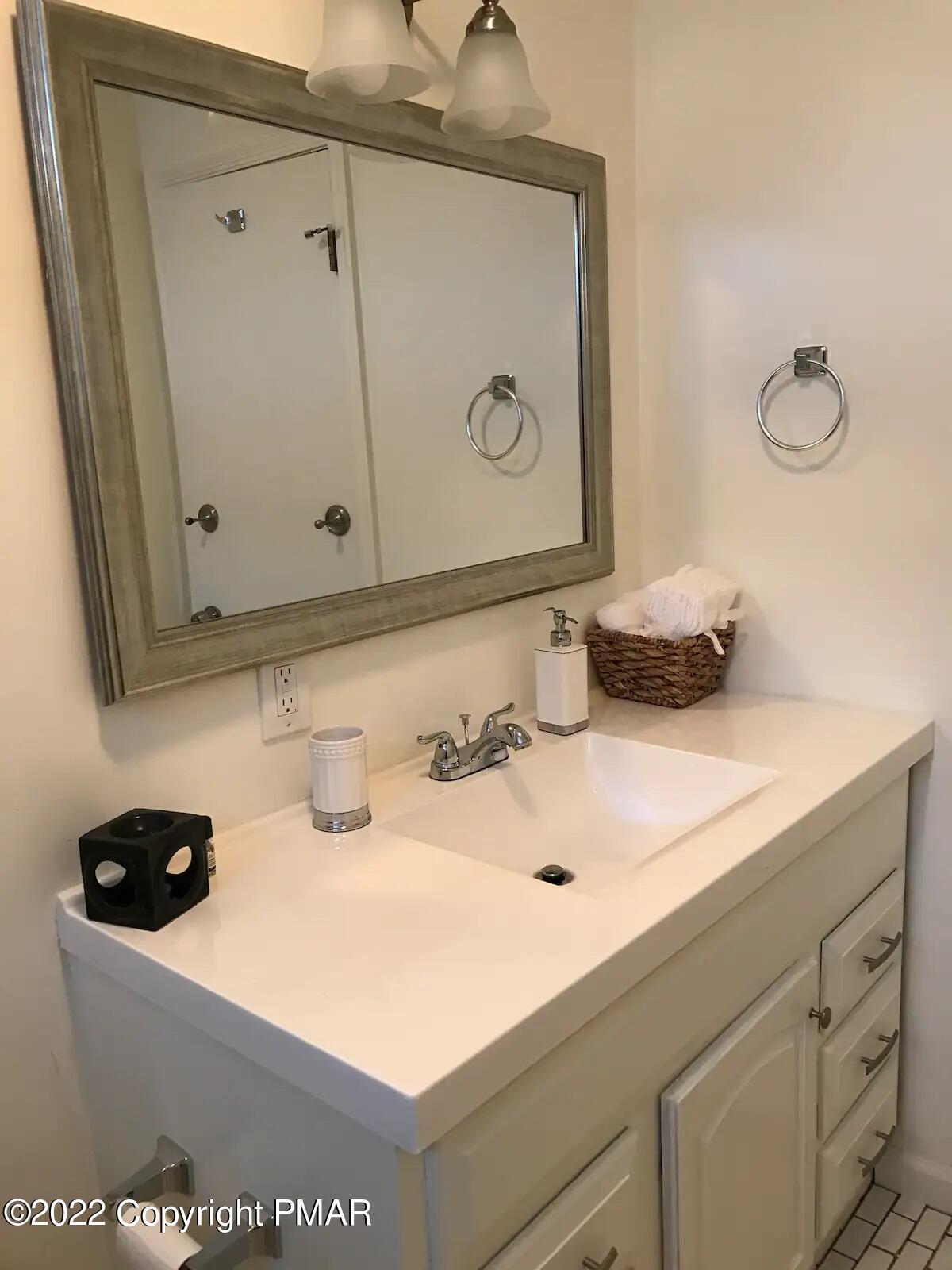 1421 Clover Road Long Pond, PA 18334 - Photo 21 of 31 a bathroom with a sink and a mirror