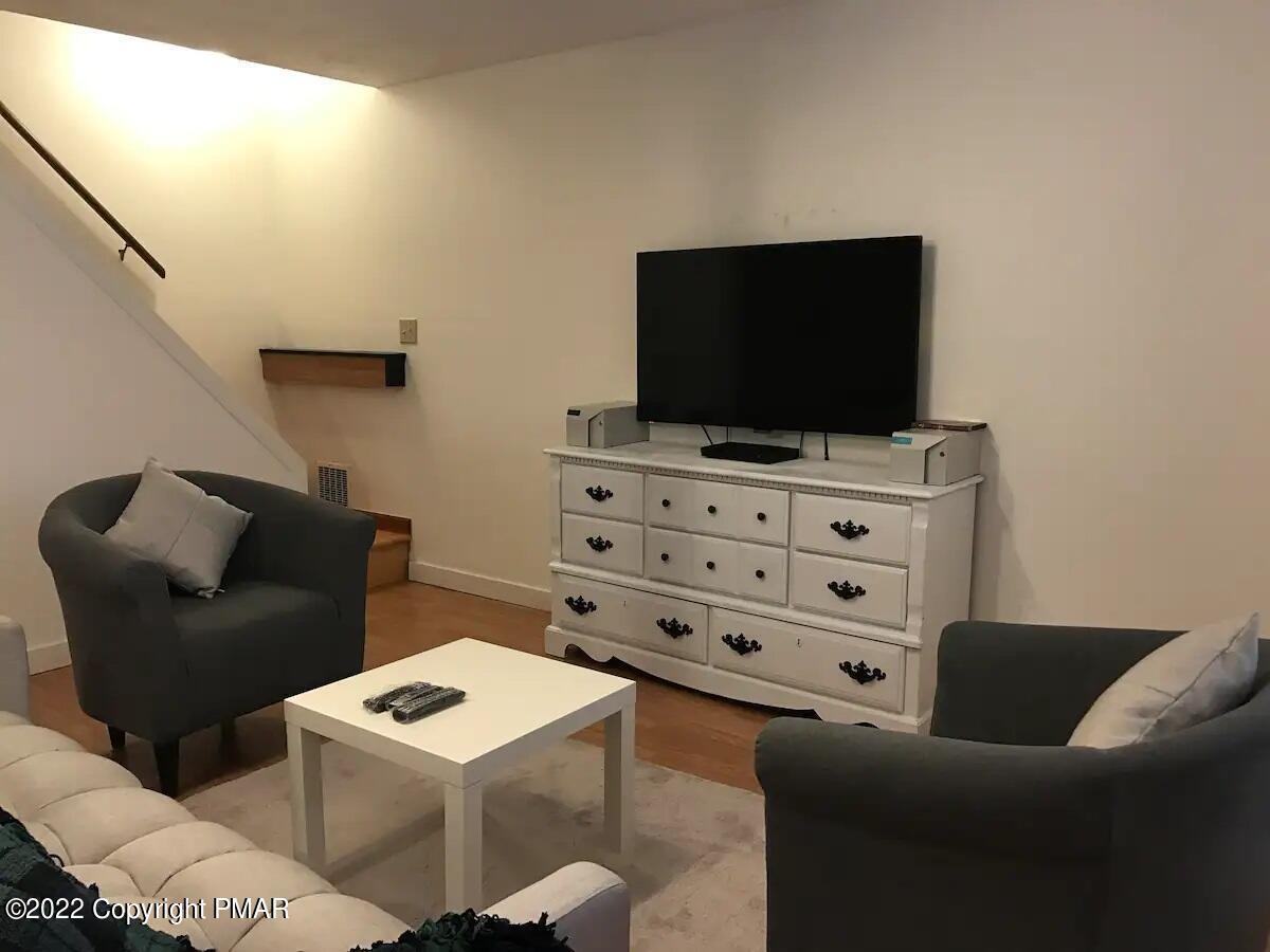 1421 Clover Road Long Pond, PA 18334 - Photo 23 of 31 a living room with furniture and a flat screen tv