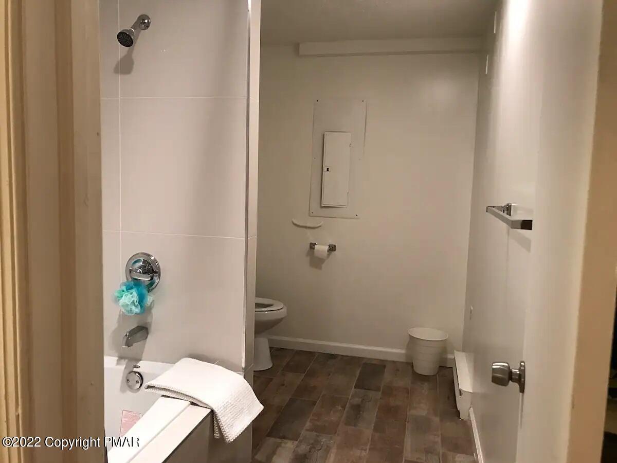 1421 Clover Road Long Pond, PA 18334 - Photo 28 of 31 a white toilet sitting next to a bathroom sink