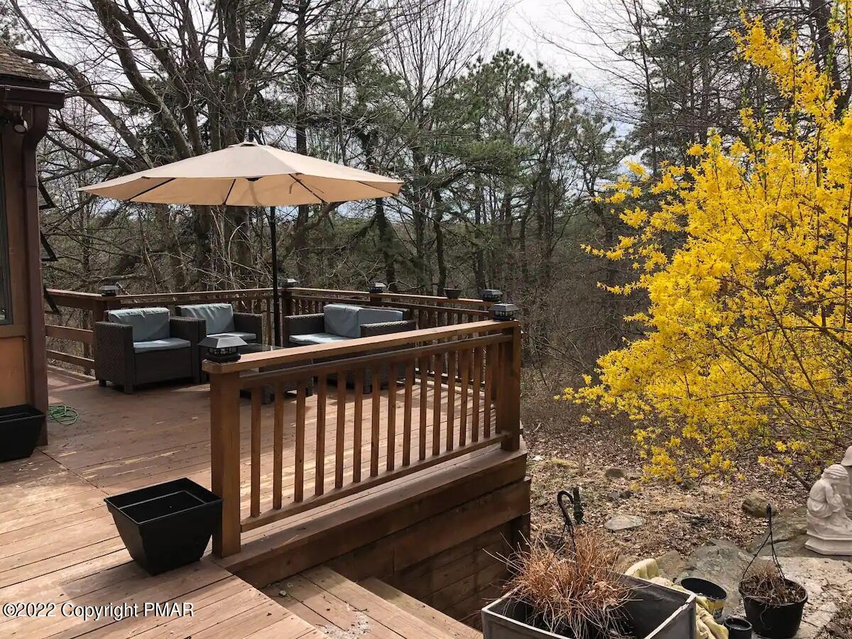1421 Clover Road Long Pond, PA 18334 - Photo 30 of 31 a blue and white umbrella sitting in the roof deck