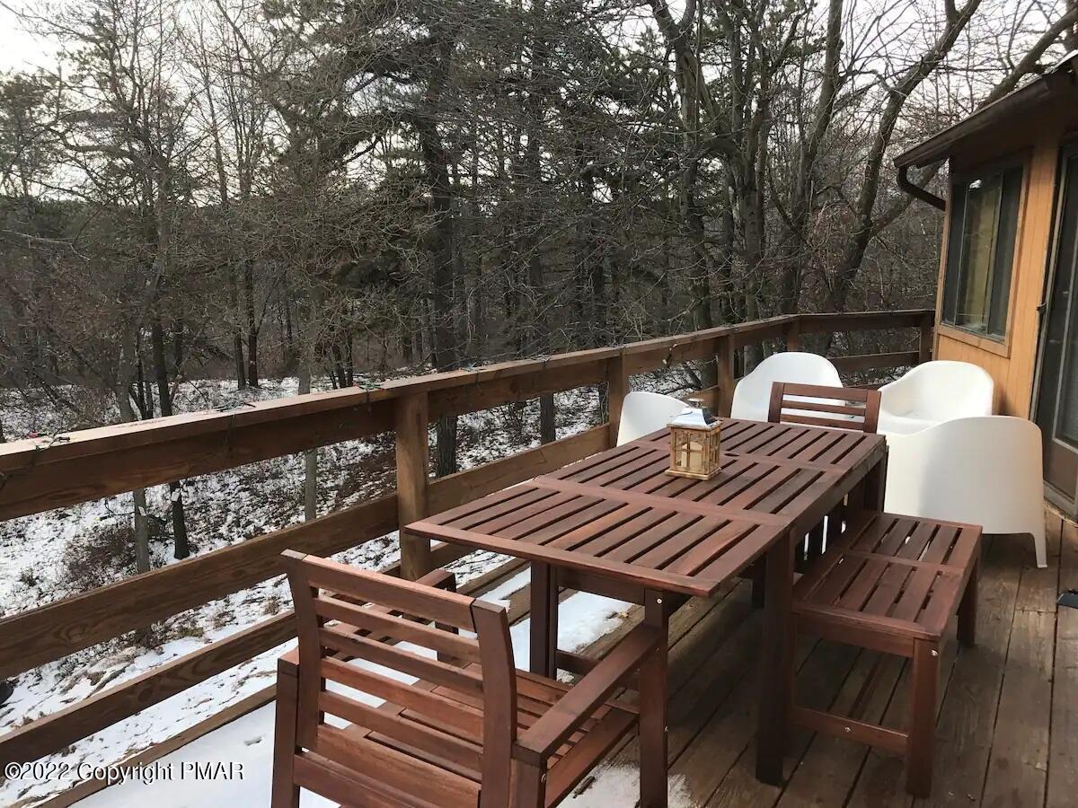 1421 Clover Road Long Pond, PA 18334 - Photo 31 of 31 a view of a balcony with wooden floor and outdoor seating