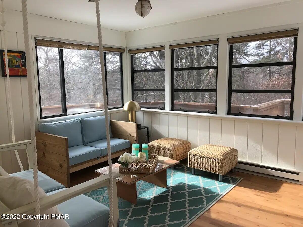 1421 Clover Road Long Pond, PA 18334 - Photo 4 of 31 a living room with furniture and large windows