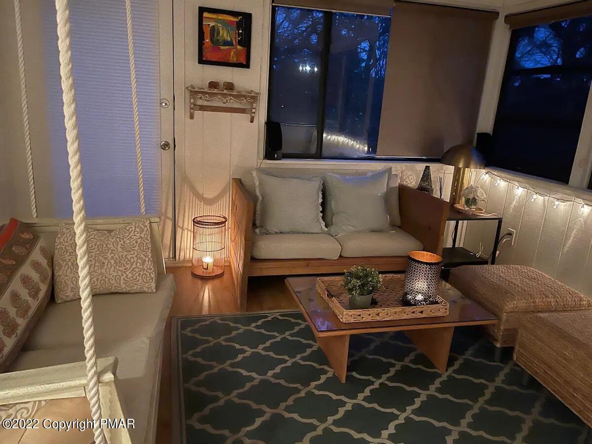 1421 Clover Road Long Pond, PA 18334 - Photo 6 of 31 a living room with furniture a rug and a fireplace