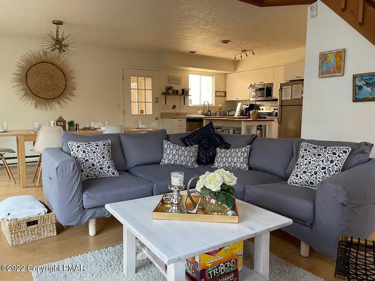 1421 Clover Road Long Pond, PA 18334 - Photo 8 of 31 a living room with furniture and wooden floor