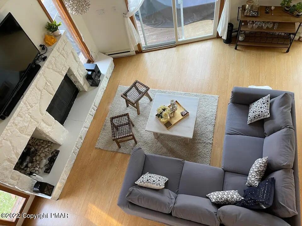 1421 Clover Road Long Pond, PA 18334 - Photo 10 of 31 a living room with furniture and a flat screen tv