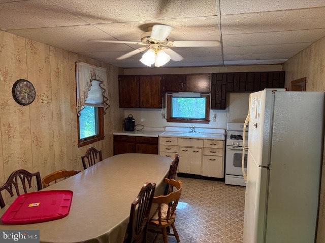 745 Germantown Road Blain, PA 17006 - Photo 10 of 12 a kitchen with refrigerator a sink dishwasher a dining table and chairs with wooden floor