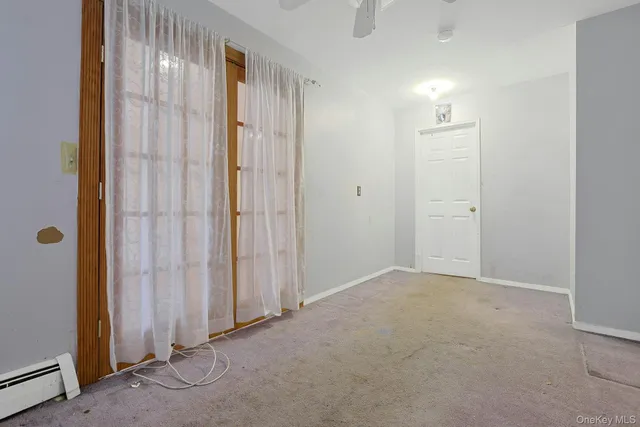 an empty room with closet area