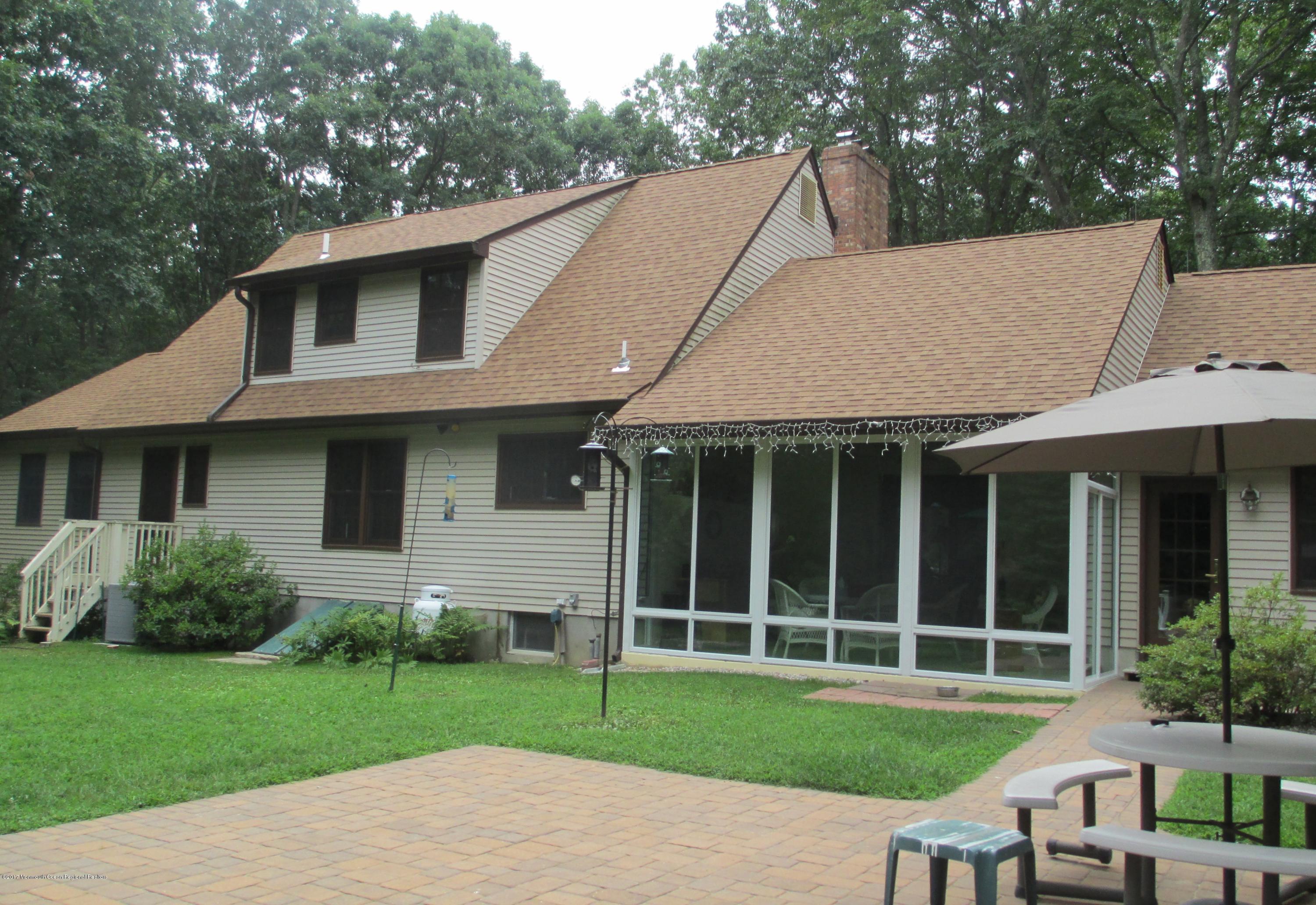 58 Hopkins Road New Egypt, NJ 08533 - Photo 23 of 30 a view of a house with a yard and sitting area