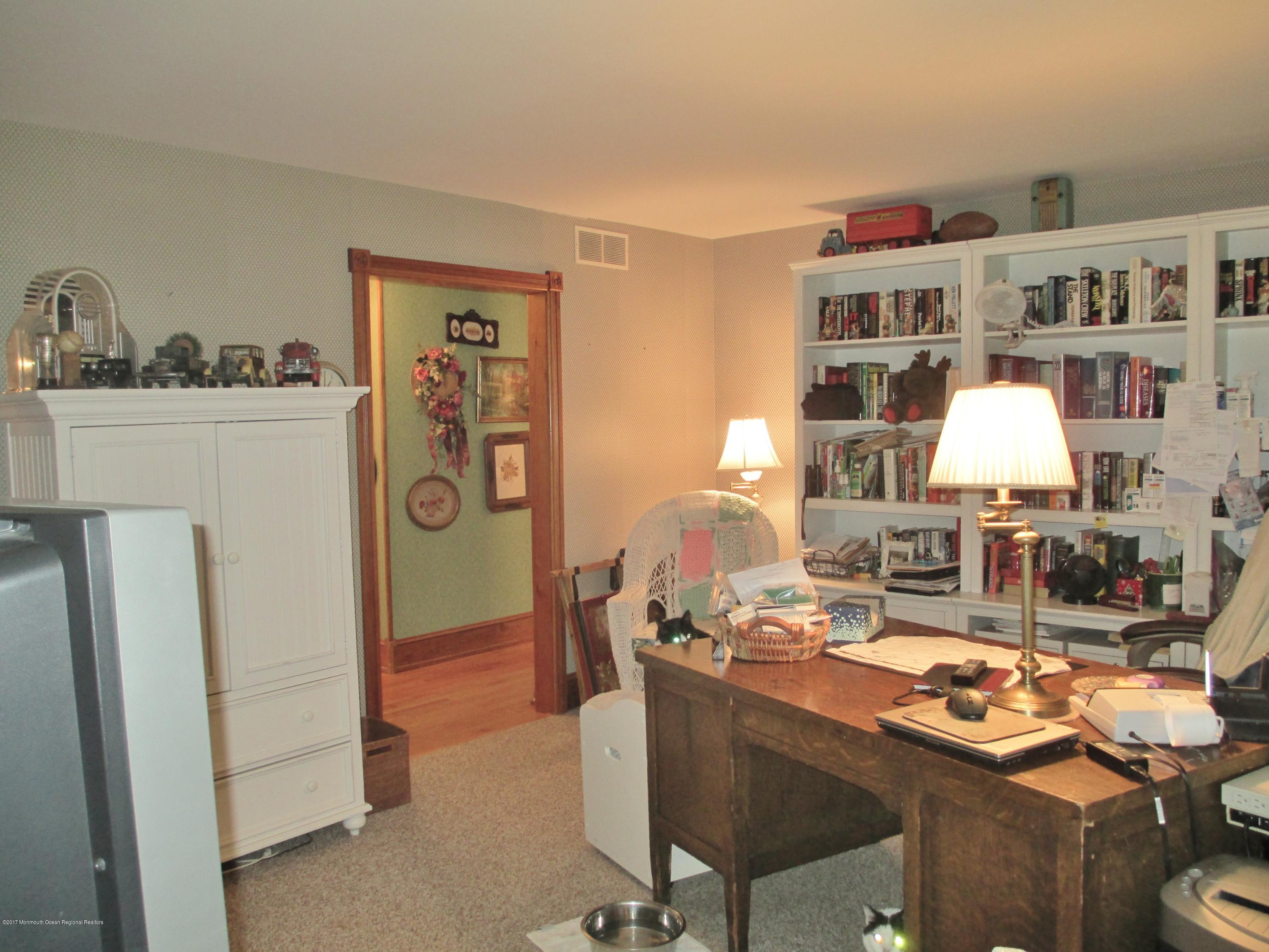 58 Hopkins Road New Egypt, NJ 08533 - Photo 10 of 30 a living room with furniture a rug and a clock