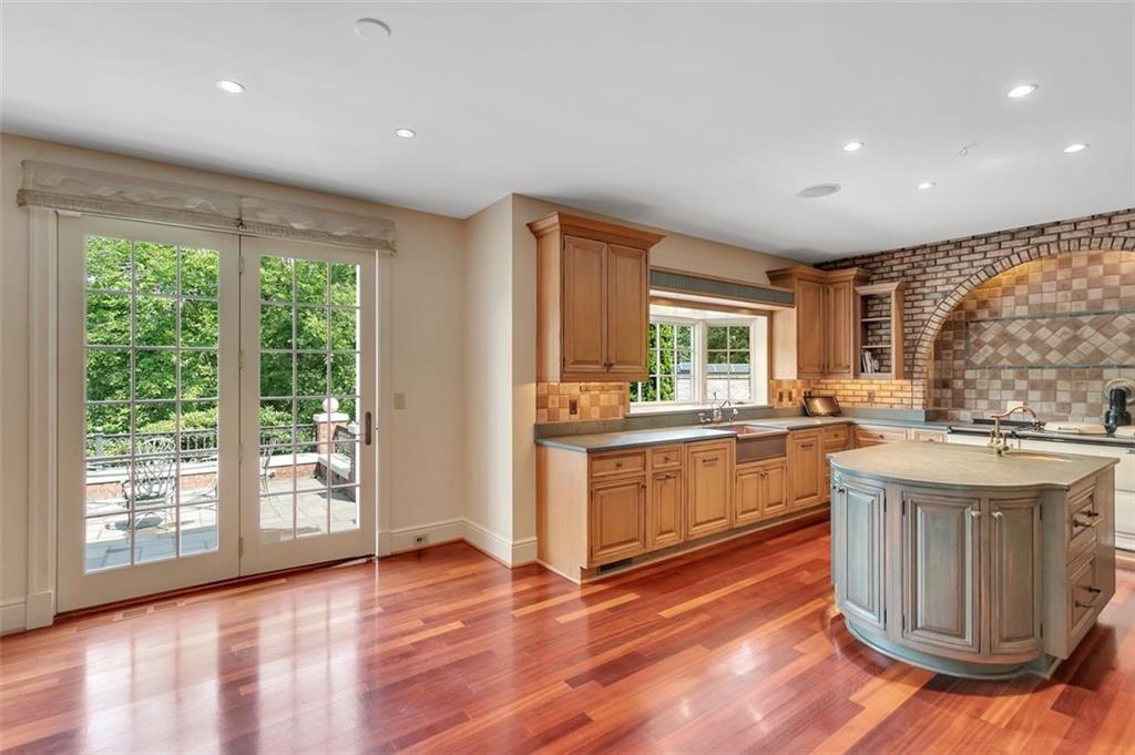 139 Peppergrass Road Baden, PA 15005 - Photo 20 of 50 The kitchen provides a spacious layout with abundant natural light and gleaming hardwood floors.