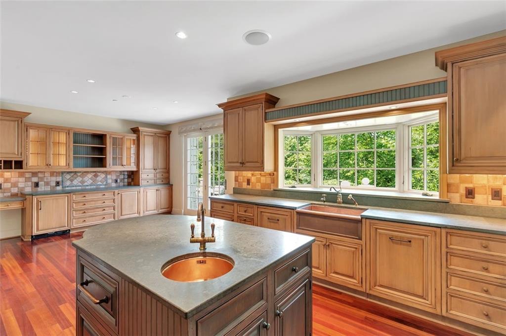 139 Peppergrass Road Baden, PA 15005 - Photo 21 of 50 Cooper sinks, Sub-Zero appliances and an AGA range adorn the kitchen.