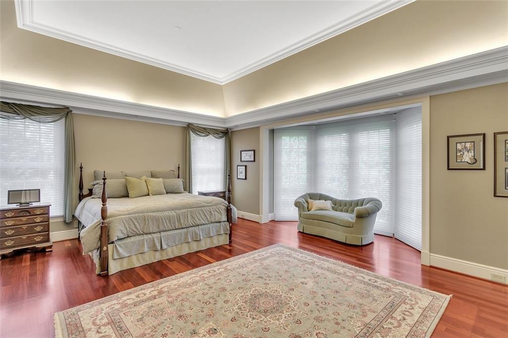 139 Peppergrass Road Baden, PA 15005 - Photo 24 of 50 The primary bedroom is a private sanctuary with fireplace, decorative woodwork and lighting, and a fireplace.