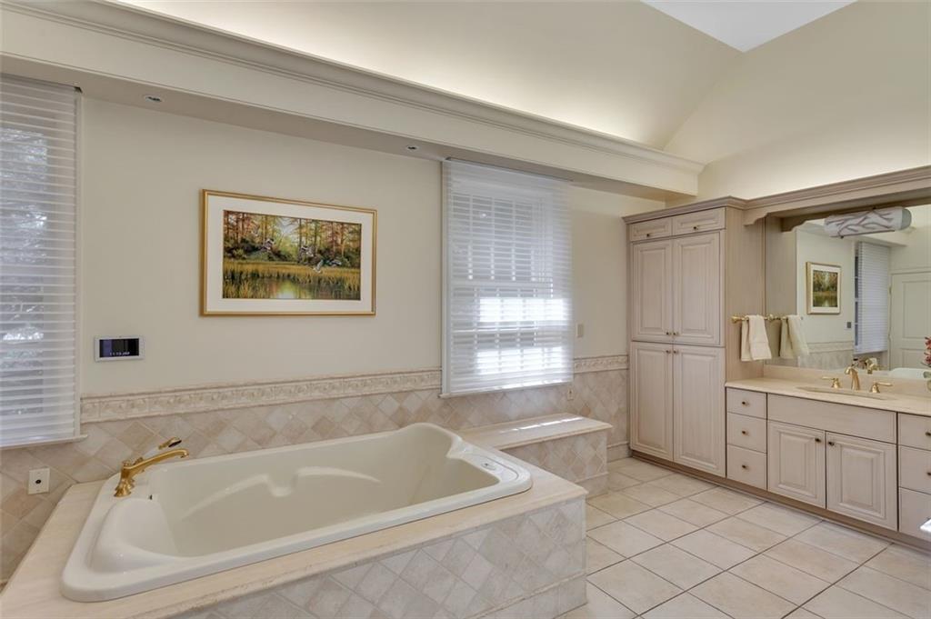 139 Peppergrass Road Baden, PA 15005 - Photo 26 of 50 The primary bathroom features a jet tub, tiled shower, and custom cabinetry.