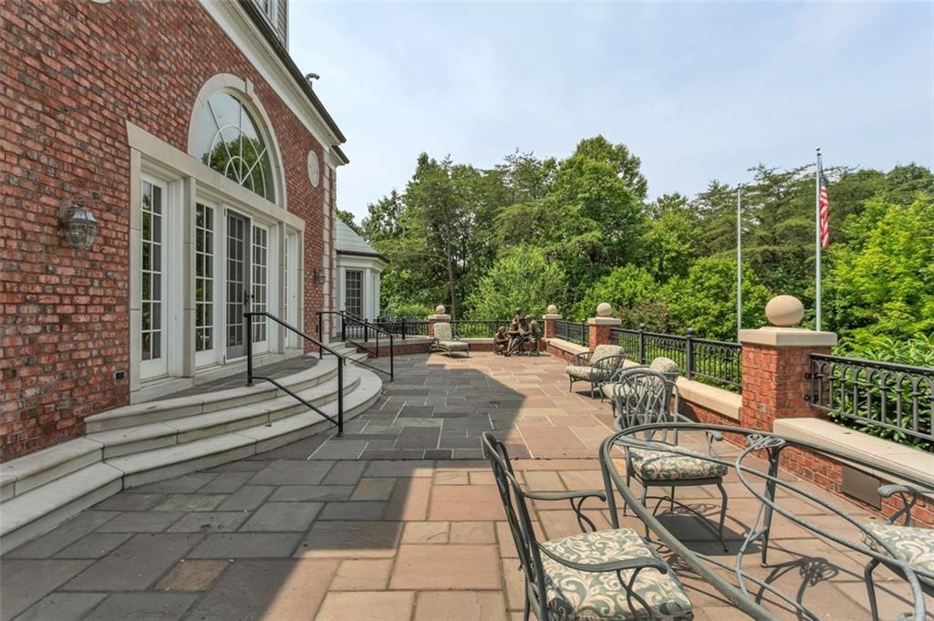 139 Peppergrass Road Baden, PA 15005 - Photo 5 of 50 The custom stone patio extends the entire length of the home.