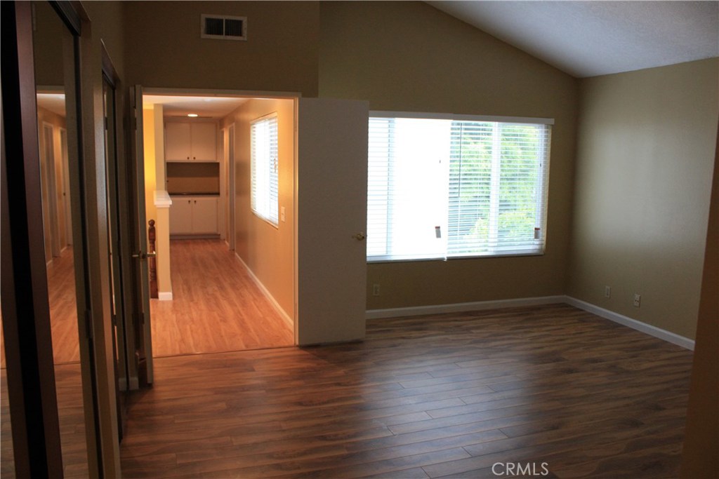 46 Oakdale Irvine, CA 92604 - Photo 17 of 26 a view of an empty room with wooden floor and a window