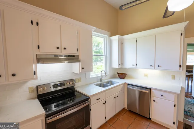 a bathroom with a sink a vanity and a mirror