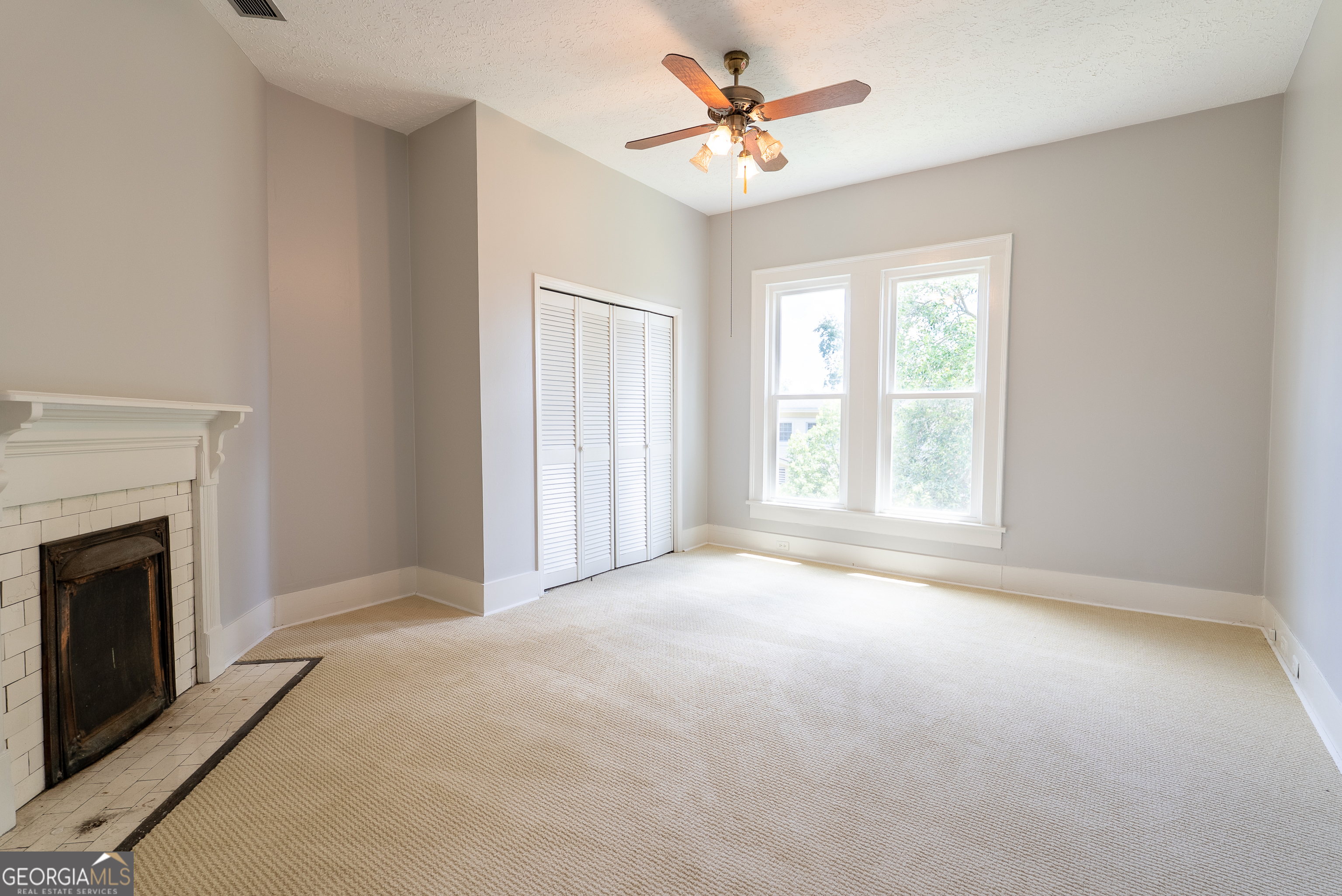 212 Hand Avenue West Pelham, GA 31779 - Photo 32 of 81 a view of an empty room with windows and fireplace