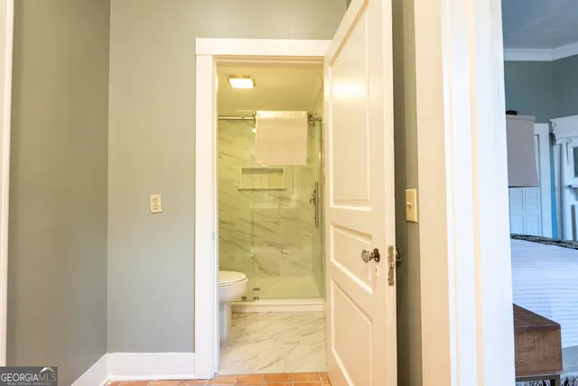 a front view of a house with swimming pool having outdoor seating