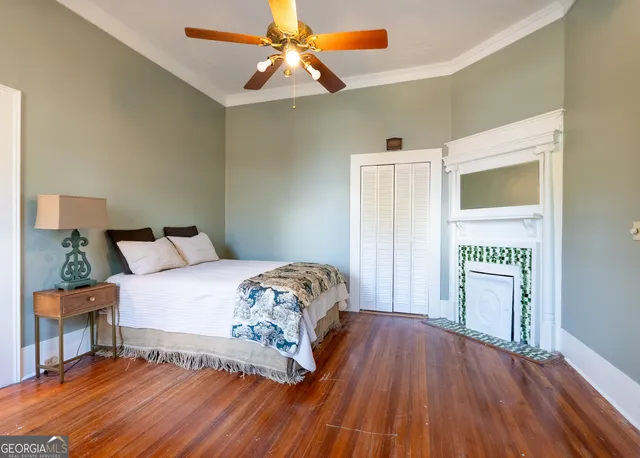 a front view of a house with garden and porch