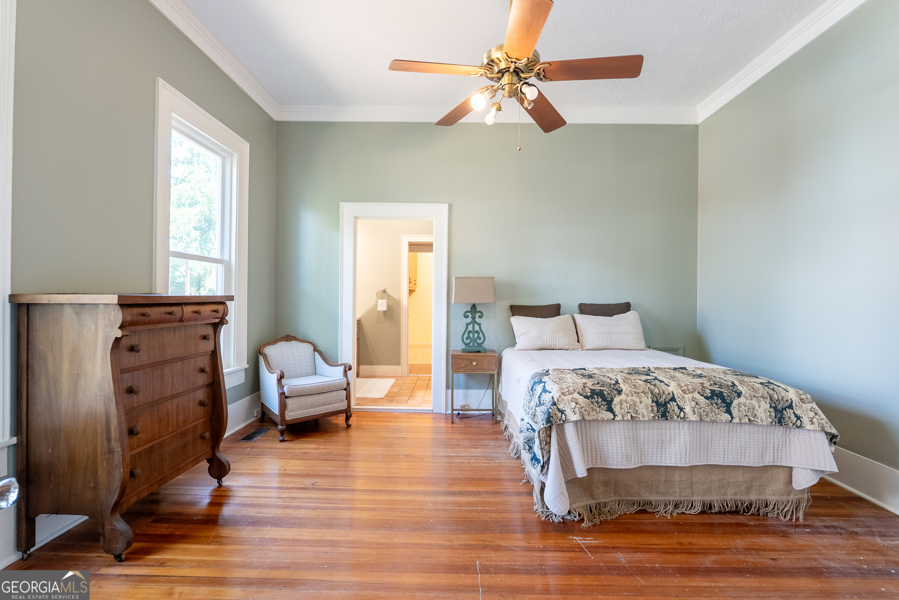 212 Hand Avenue West Pelham, GA 31779 - Photo 48 of 81 a bedroom with a bed and wooden floor