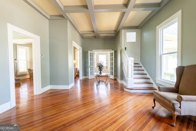 a view of a house with a yard porch and sitting area