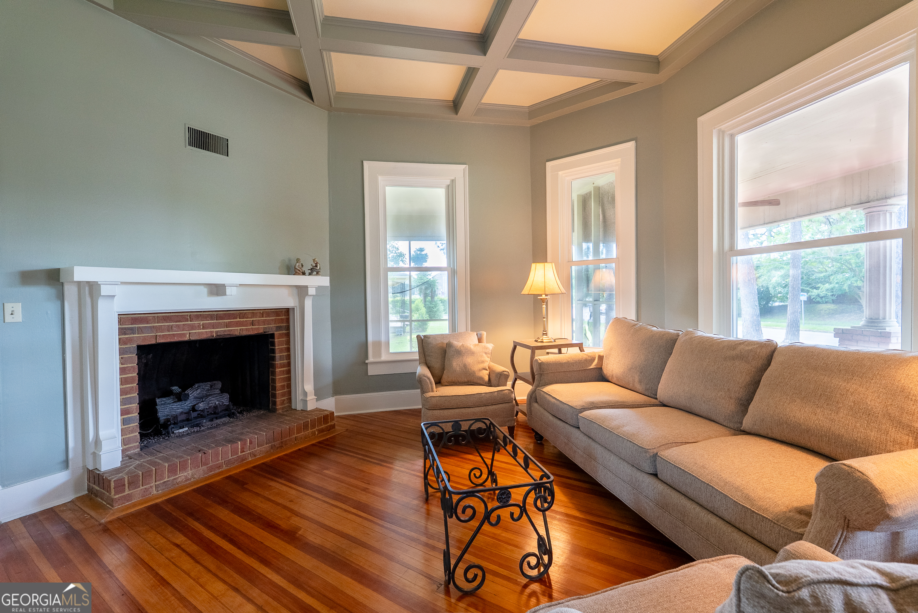 212 Hand Avenue West Pelham, GA 31779 - Photo 52 of 81 a living room with furniture and a fireplace