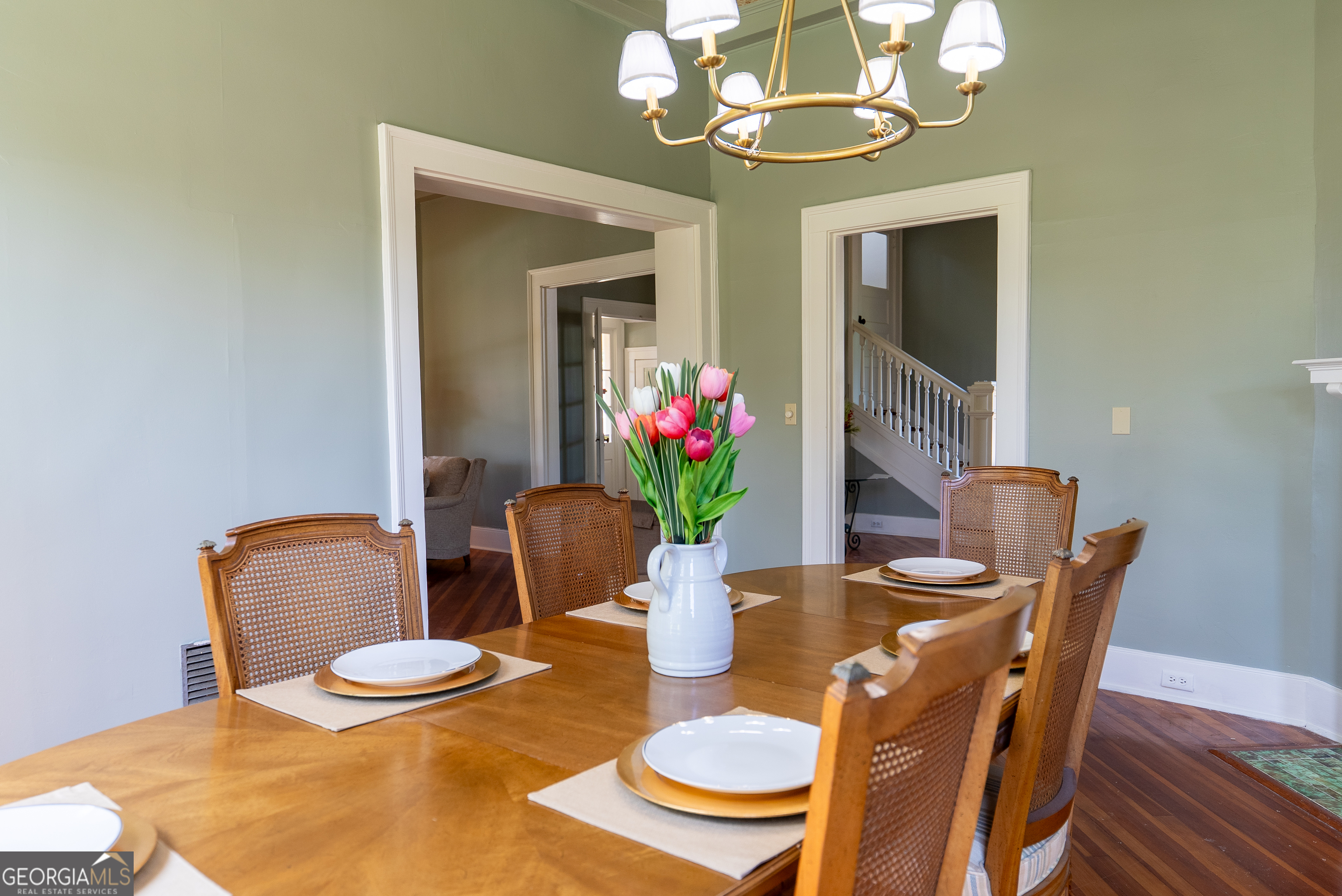 212 Hand Avenue West Pelham, GA 31779 - Photo 54 of 81 a dining room with furniture a potted plant and wooden floor