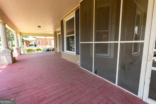 a kitchen with white cabinets and a sink
