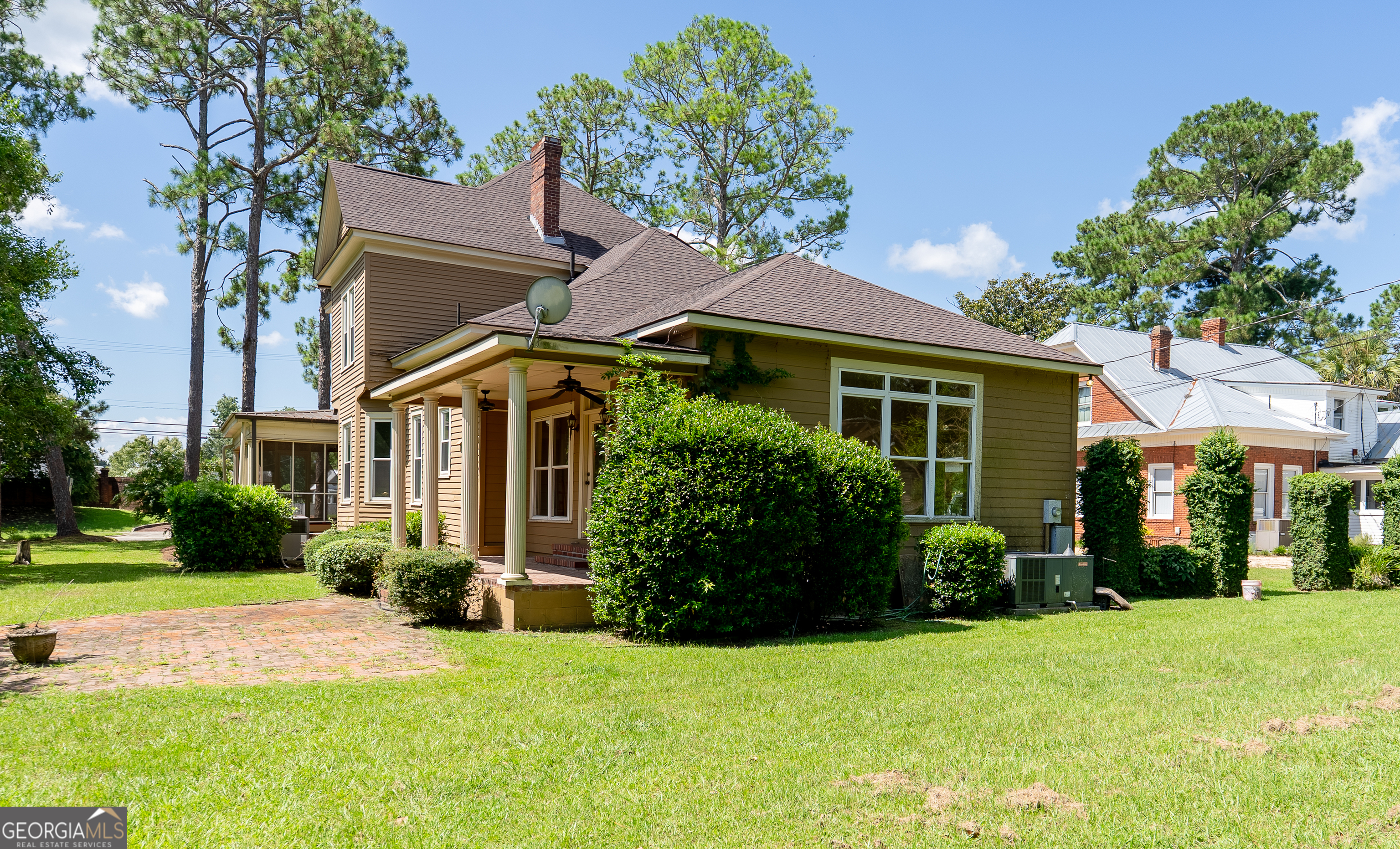 212 Hand Avenue West Pelham, GA 31779 - Photo 70 of 81 a front view of a house with a garden