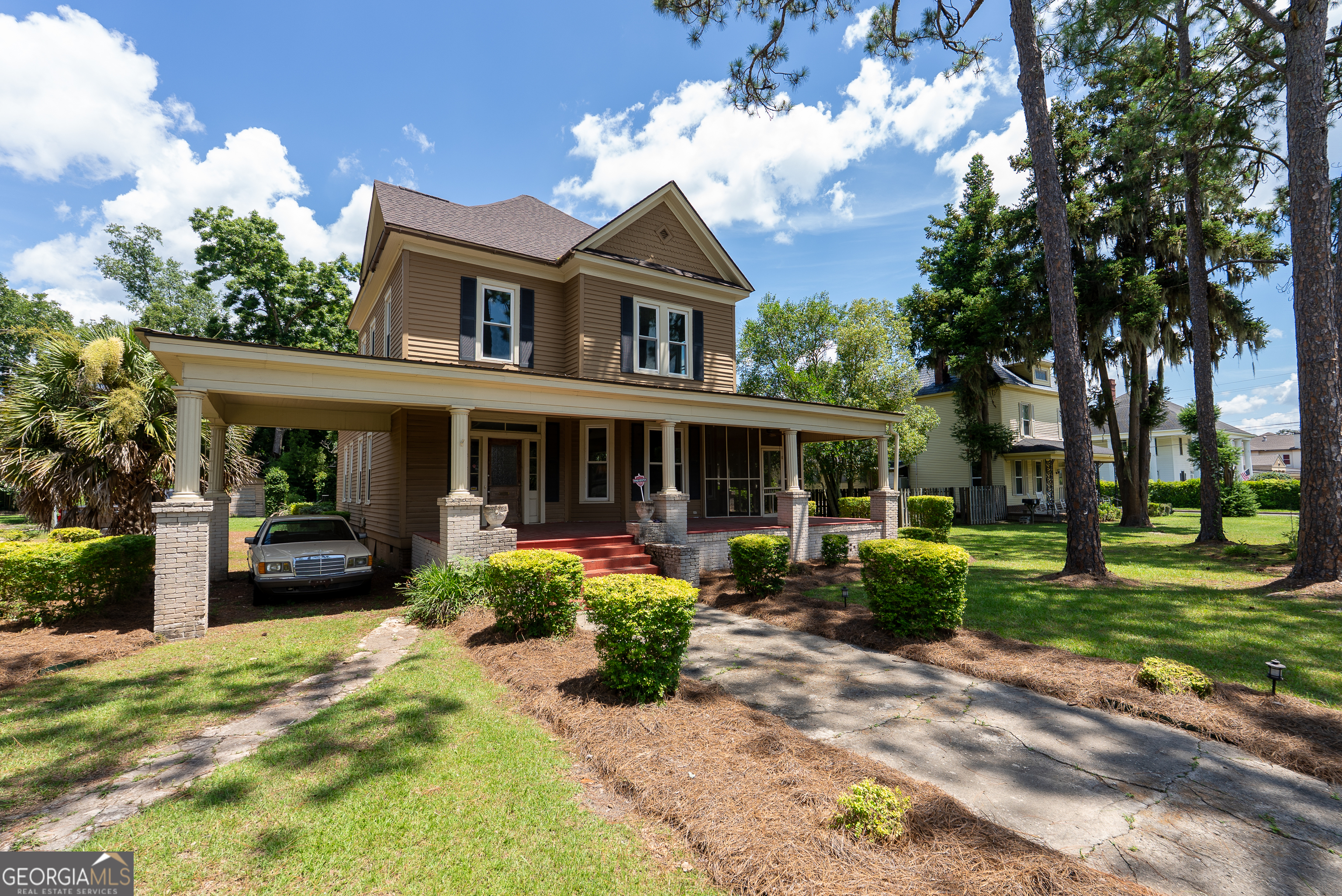 212 Hand Avenue West Pelham, GA 31779 - Photo 7 of 81 a front view of a house with garden and porch