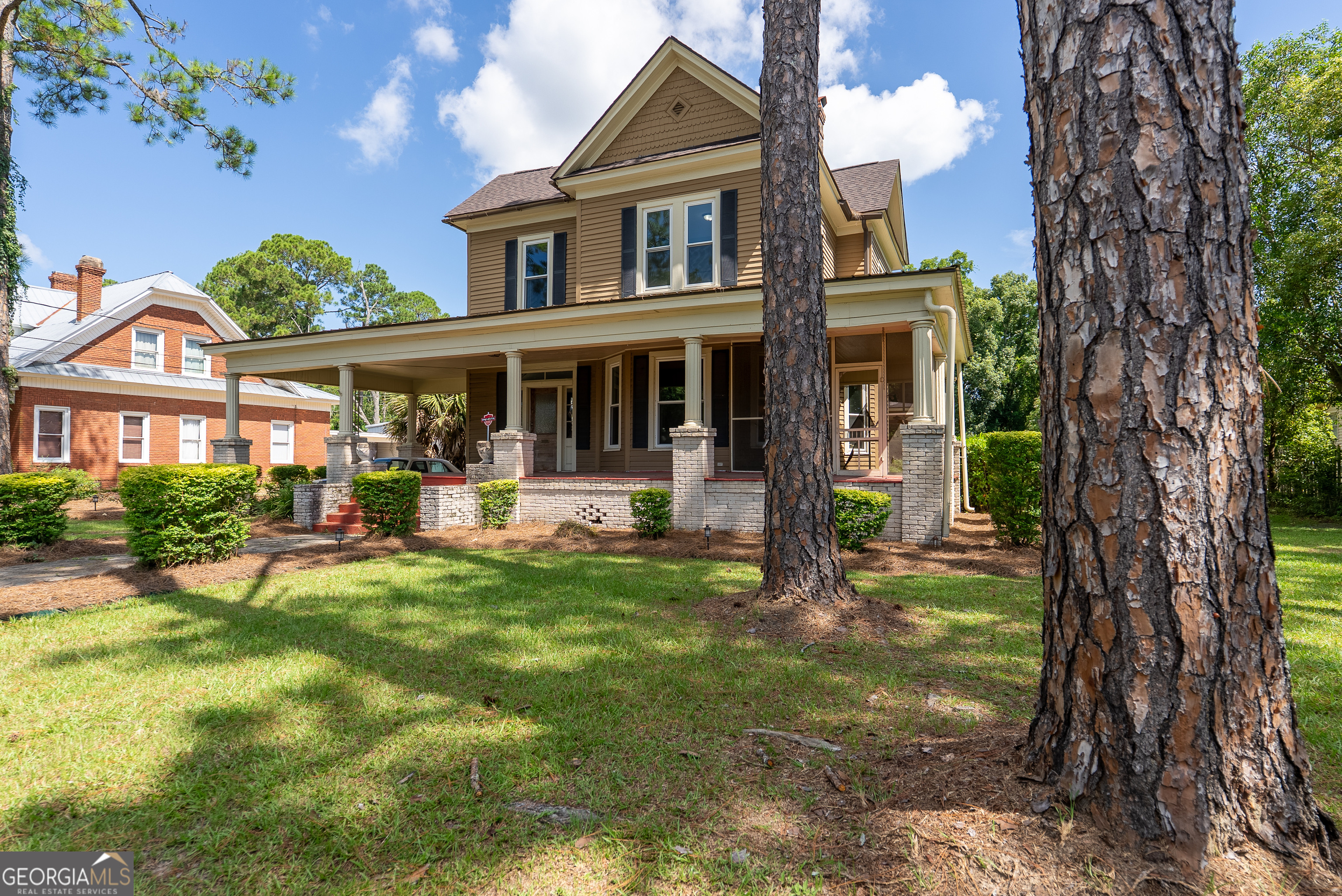 212 Hand Avenue West Pelham, GA 31779 - Photo 75 of 81 a front view of a house with swimming pool having outdoor seating