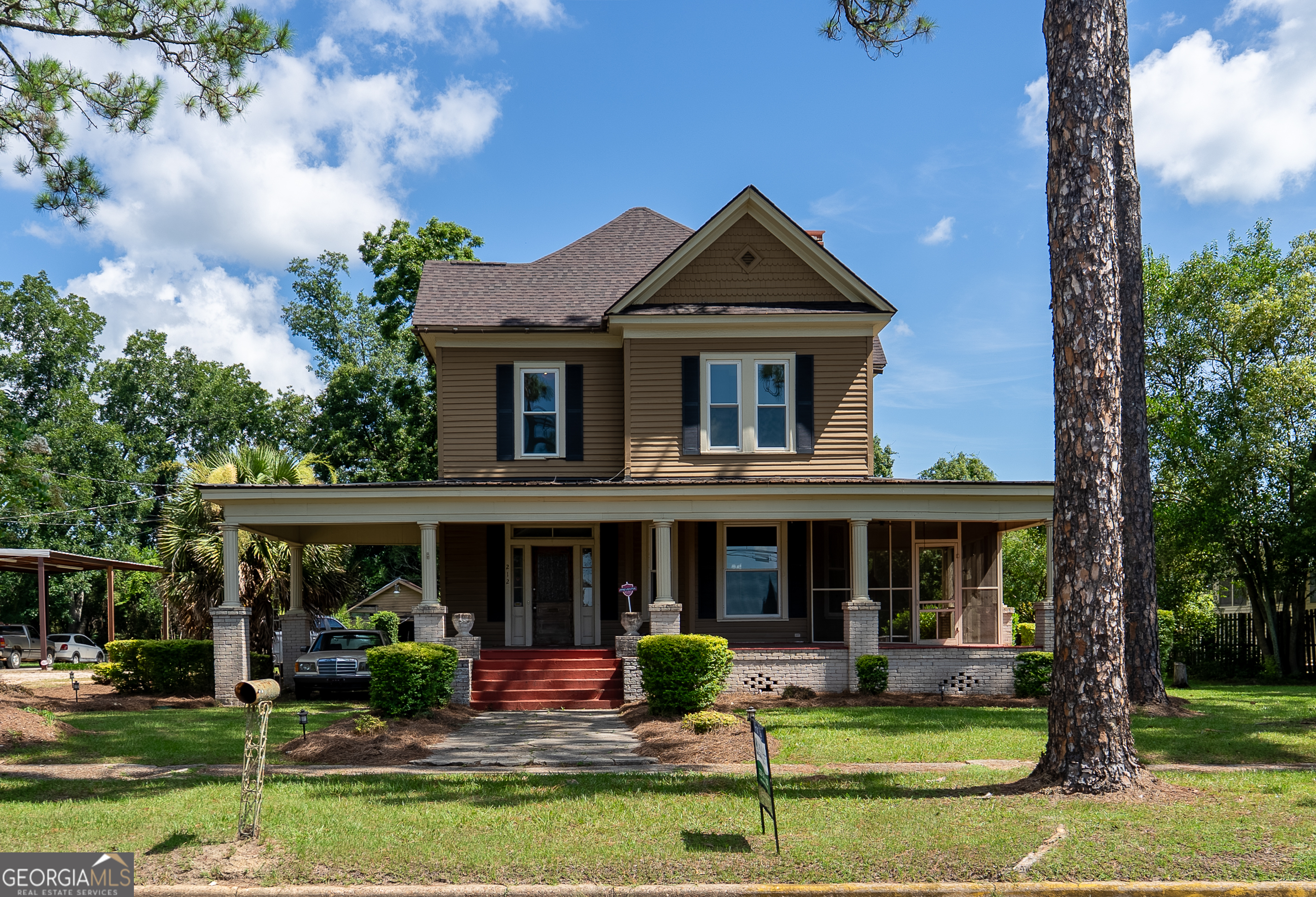 212 Hand Avenue West Pelham, GA 31779 - Photo 77 of 81 a front view of a house with garden and porch