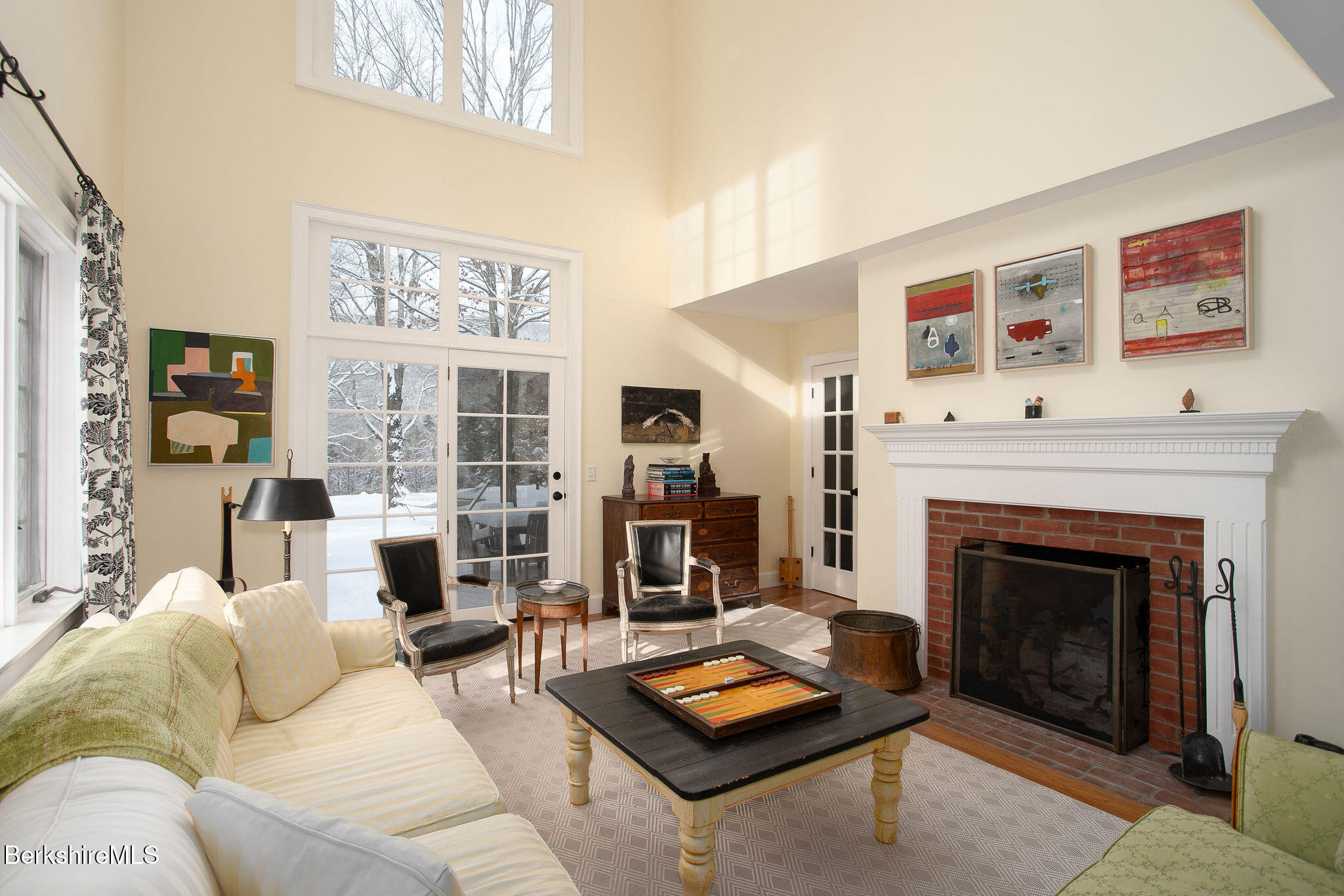 14 Old Tree Farm Road Stockbridge, MA 01266 - Photo 14 of 56 a living room with furniture a fireplace and a large mirror