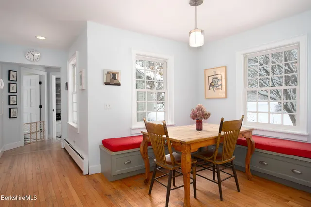 a dining room with furniture and window