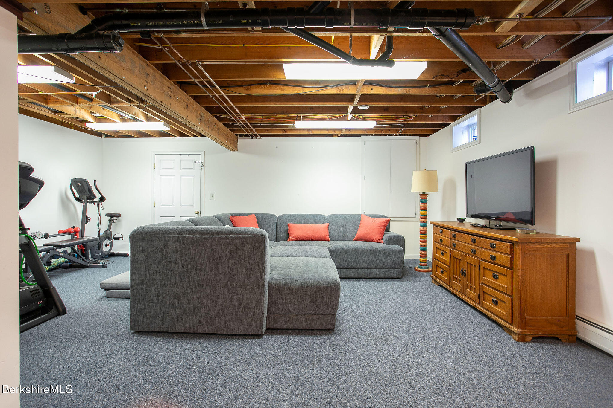 14 Old Tree Farm Road Stockbridge, MA 01266 - Photo 37 of 56 a living room with furniture and a flat screen tv