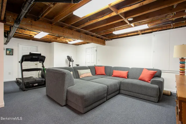 a bedroom with a bed a desk and chair