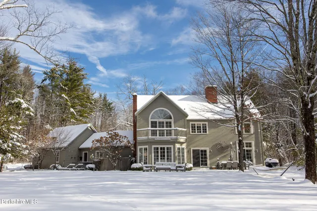 a view of a big house in the middle of a yard